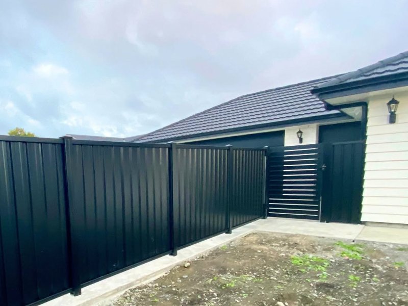 Black ColorSteel fence and slat gate