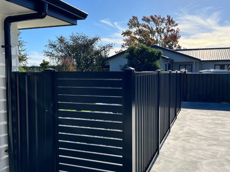 Black ColorSteel fence and slat gate