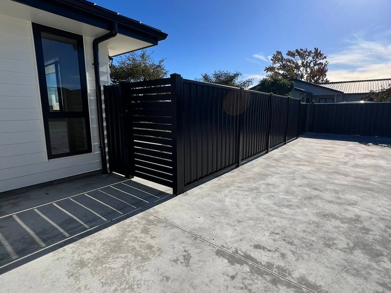 Black slat gate and fence